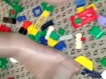 Sexy nylon feet walking on legos