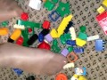 Sexy nylon feet walking on legos