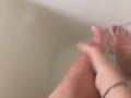 Girl washing sore feet and ankles after working long shift