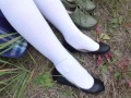 Schoolgirl in white socks changes shoes and shows her feet pantyhose knee socks