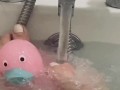 My feet in the bath playing with my rubber duck 