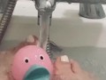 My feet in the bath playing with my rubber duck 