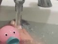 My feet in the bath playing with my rubber duck 