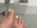 My feet in the bath playing with my rubber duck 