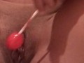 Masturbation with a lollipop
