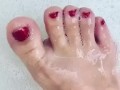 Cute toes in a bubble bath