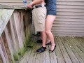 Holding my boyfriend's dick while he pisses off the deck | outside piss | high heels | sexy legs