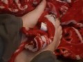 Cute tiny feet rubbing blanket