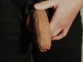 Thick uncut dick growing in black jeans. Natural foreskin. Cum on black plate.