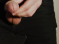 Thick uncut dick growing in black jeans. Natural foreskin. Cum on black plate.
