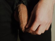 Thick uncut dick growing in black jeans. Natural foreskin. Cum on black plate.