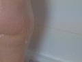 Hot sexy teen fingers her ass and plays with her nipple piercing tits in the shower as she cums