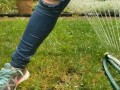 Wetting My Jeans Into sockless Shoes then soaking in the sprinkler