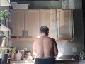 I cook breakfast with my huge tits out, smoking a blunt