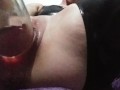 Slut fucks bottle and squirts