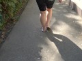 BBW in flip flops walks along the sidewalk while a voyeur peeps on her feet Public foot fetish