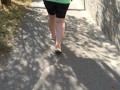 BBW in flip flops walks along the sidewalk while a voyeur peeps on her feet Public foot fetish