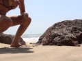 GIRL HIDDING BETWEN ROCKS ON THE PUBLIC BEACH FOR PEE