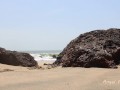 GIRL HIDDING BETWEN ROCKS ON THE PUBLIC BEACH FOR PEE