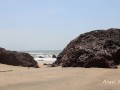 GIRL HIDDING BETWEN ROCKS ON THE PUBLIC BEACH FOR PEE