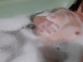 Girl masturbates in the bath and moans loudly