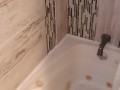 Sexy Ebony babe takes a shower caressing small tits and ass