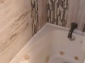 Sexy Ebony babe takes a shower caressing small tits and ass