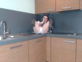 Schoolgirl plays in the kitchen