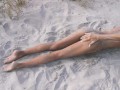 Amateur nudist teen fucks her tight pussy with a huge cucumber on a public beach. Ends with a pee.