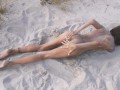 Amateur nudist teen fucks her tight pussy with a huge cucumber on a public beach. Ends with a pee.