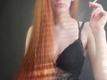 redhead girl sexually smokes a cigarette