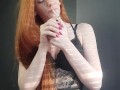 redhead girl sexually smokes a cigarette