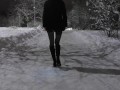 Public winter walk backlit in the ass