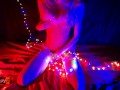 Snow Maiden brings herself to orgasm in Christmas lights