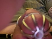 Caged sissy cumming with a vibrator 