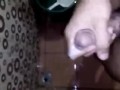 Horny Young Guy Having Fun Jerking Off His Huge Cock in the Toilet
