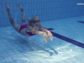 Elena Proklova spreading legs underwater