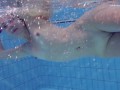 Elena Proklova spreading legs underwater