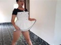 Nice woman shows her body when undressing from very short white-black dress.