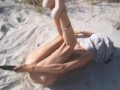 Tight Pussy takes a Hot Golden Shower while being Penetrated by a Cucumber on the Beach