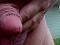 Huge flaccid penis peeing outdoors