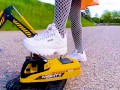 Big excavator is destroyed kicked, trampled, crushed, smashed, crushed, broken plastic car, crush