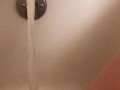 Horny hot thick MILF wiggles hips and uses bath tub faucet to get off in bathtub