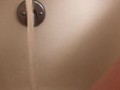 Horny hot thick MILF wiggles hips and uses bath tub faucet to get off in bathtub