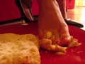 High heels and barefoot crush of a cream cake