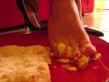 High heels and barefoot crush of a cream cake