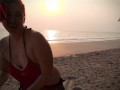 Nice lady at lonely nudist beach. Red swimsuit. Red bikini. Coconut