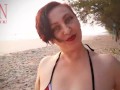 Nice lady at lonely nudist beach. Red swimsuit. Red bikini. Coconut