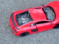 Crush of Red Audi R8 model toy car with Black Pump Stilettos