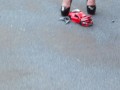 Crush of Red Audi R8 model toy car with Black Pump Stilettos